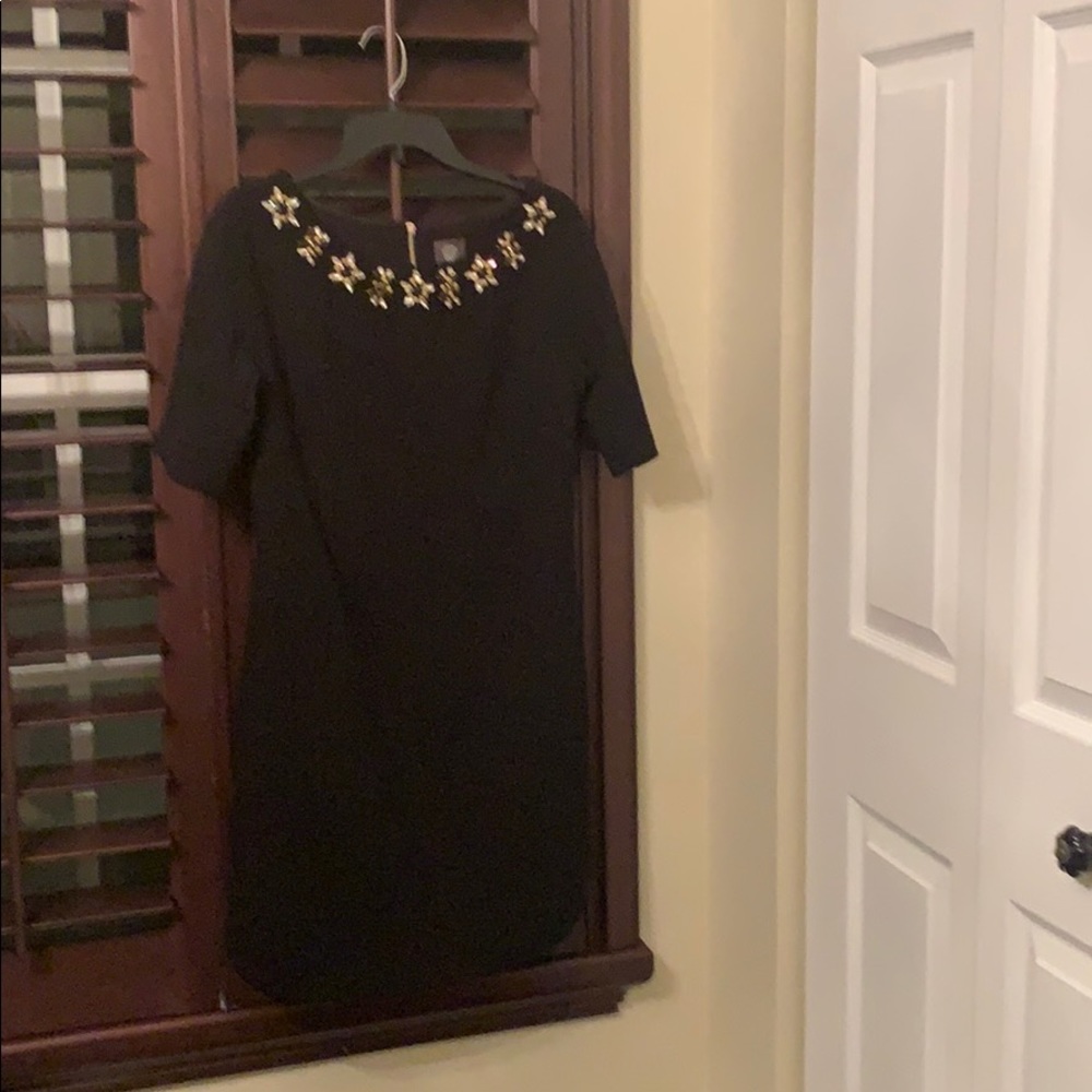 Little black dress with rhinestone neck.